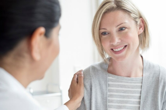 patient smiling with nurse