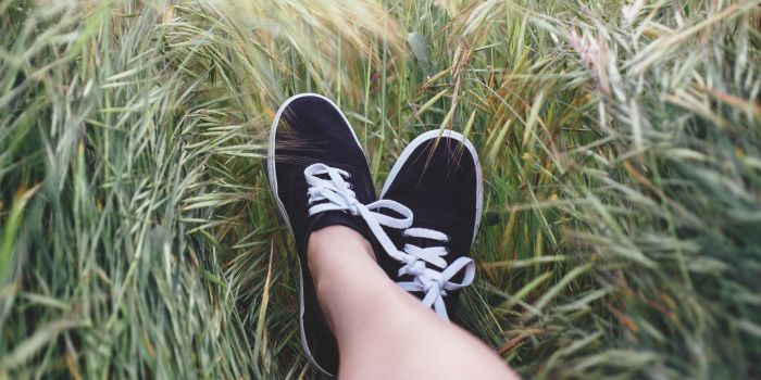 Feet lying on the grass