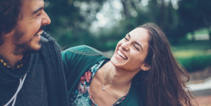 a man and woman laughing, having fun