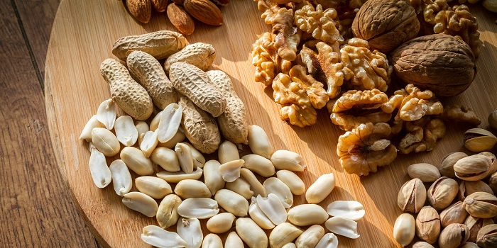 mixed nuts on a wooden board