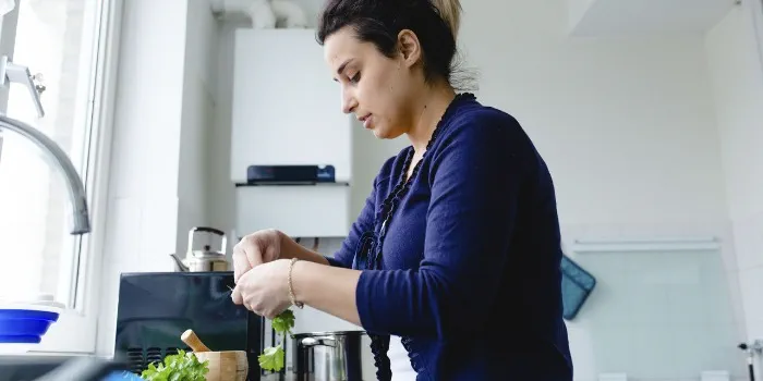 a woman cooking in the kitchen