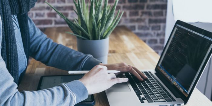 An image of a person on a laptop