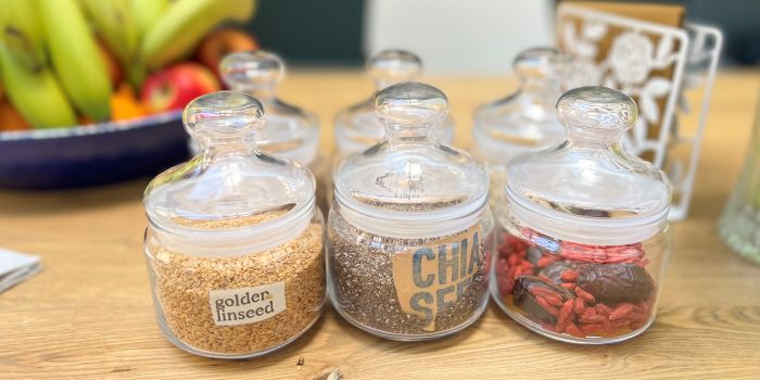 jars of edible seeds on a table