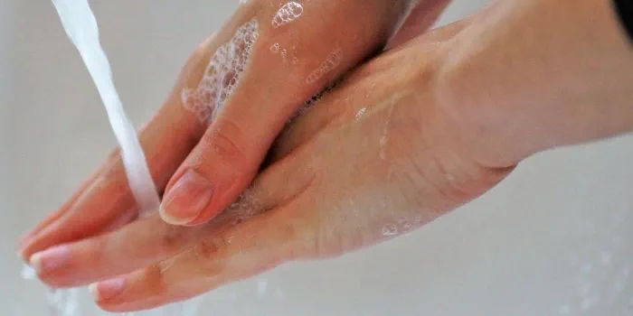a person washing hands