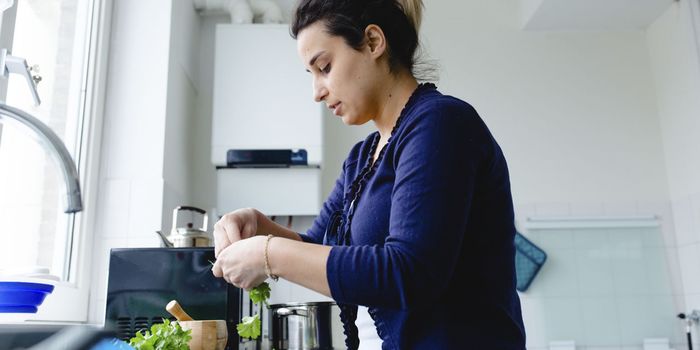 a woman cooking in the kitchen