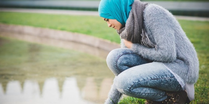 woman with a head scarf at the park