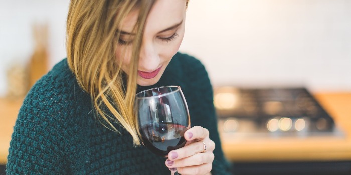 woman holding a glass of wine