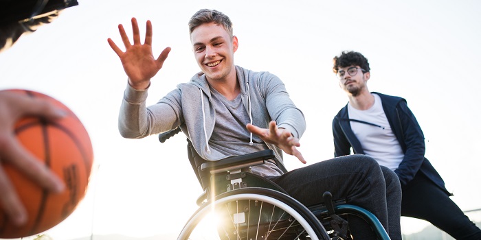 two men playing wheelchair basketball