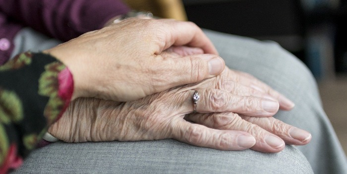 A couple's interlocking hands