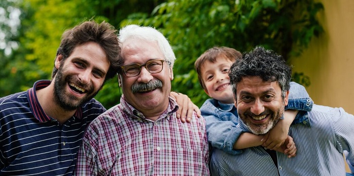 A group of men smiling