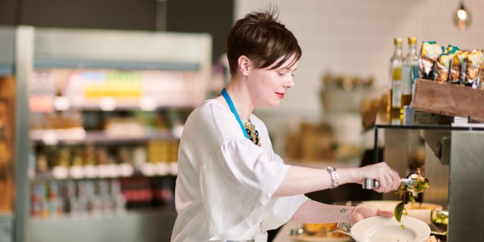 a woman at a salad bar