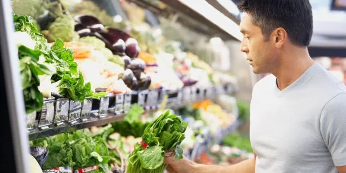 person shopping for fruit and veg