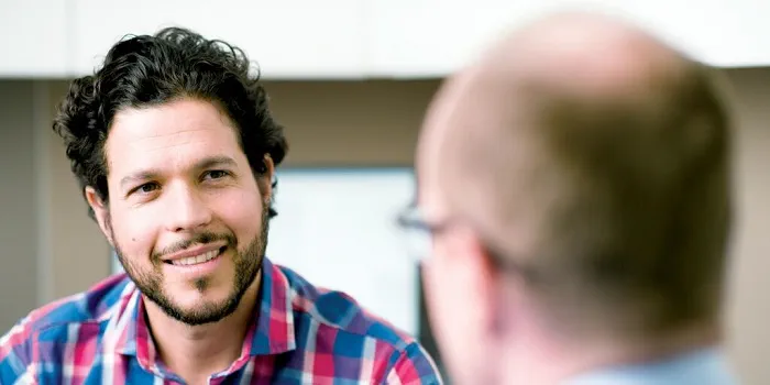 a man talking to a doctor