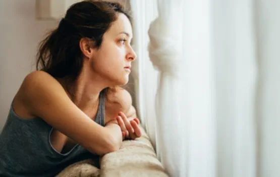 woman looking out of the window