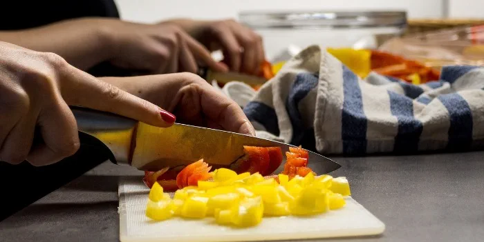 people chopping vegetables