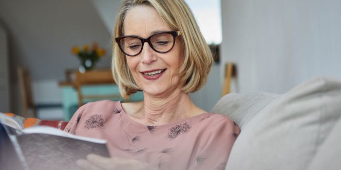 person reading a book at home