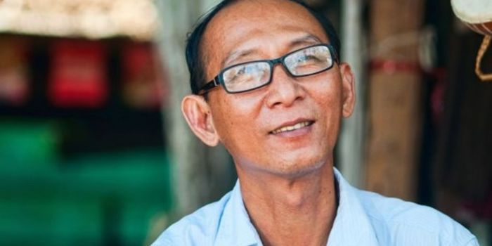 Man wearing glasses standing outdoors