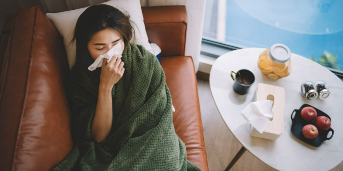 person lying on the couch feeling unwell
