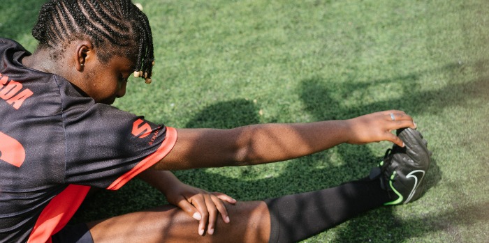 teenager stretching outdoors