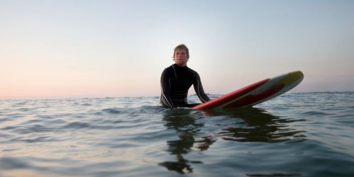 person waiting for a wave while surfing