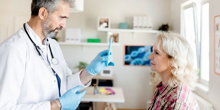 doctor examining patient