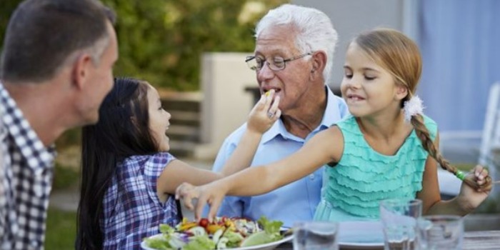 family eating together outdoors