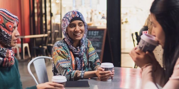 group of people having a warm drink together