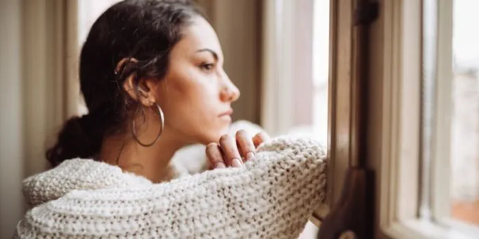 person gazing out of the window