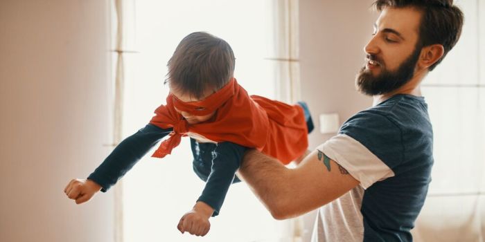 parent and child playing together indoors