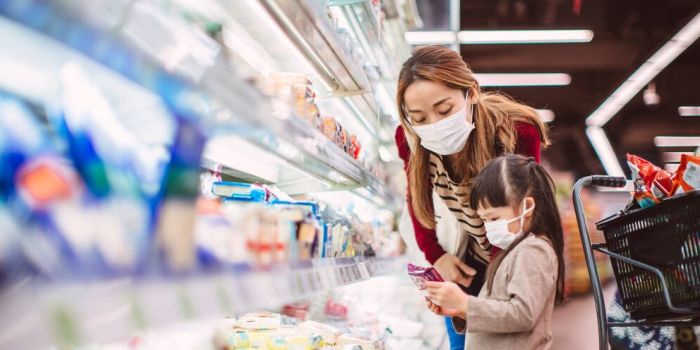 adult and child grocery shopping