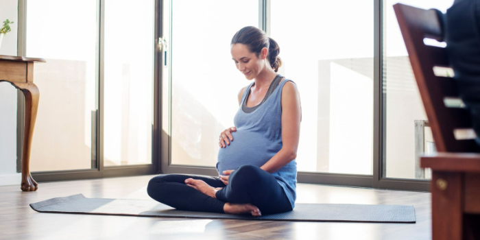 pregnant woman doing yoga