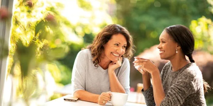 two people having tea outdoors