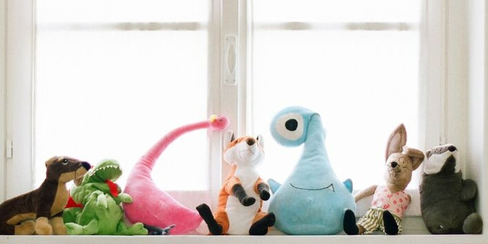 plushies on a window seat