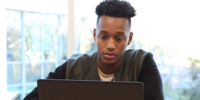 teenager on a laptop