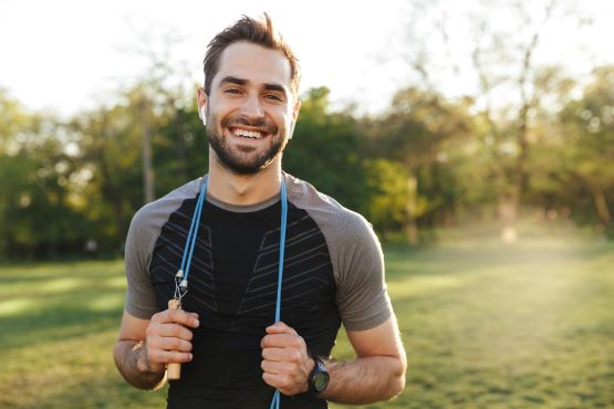 person with a skipping rope outdoors