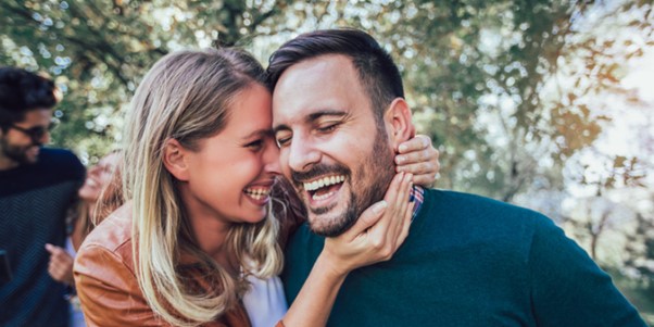 a happy couple laughing