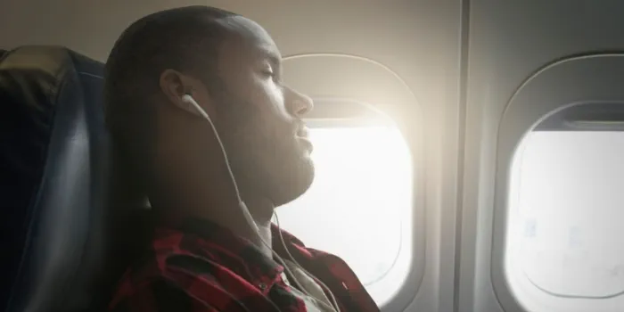person sleeping on a flight