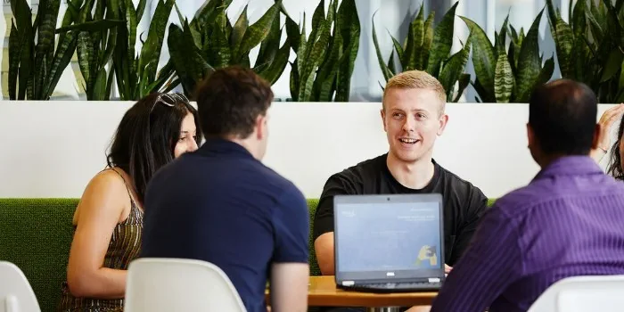 people sitting down for a meeting in the office