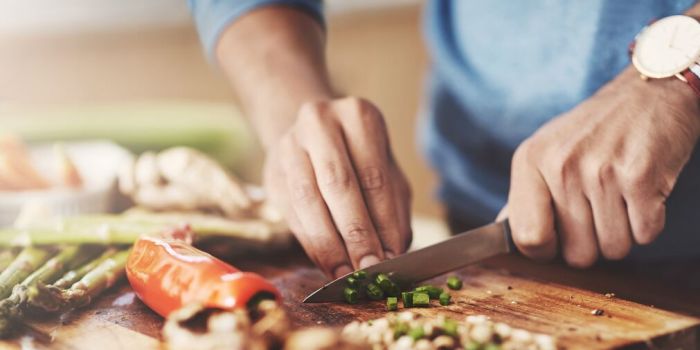 cutting vegetables on a chopping board