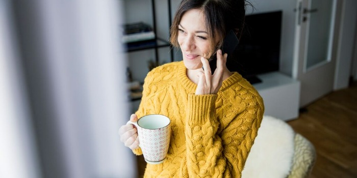 person smiling on the phone