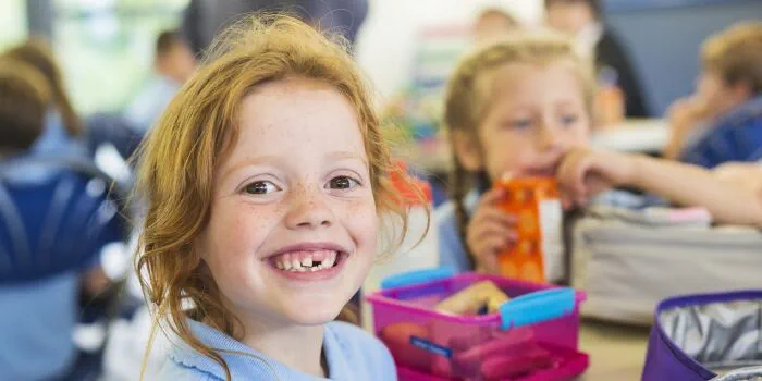 child smiling at school