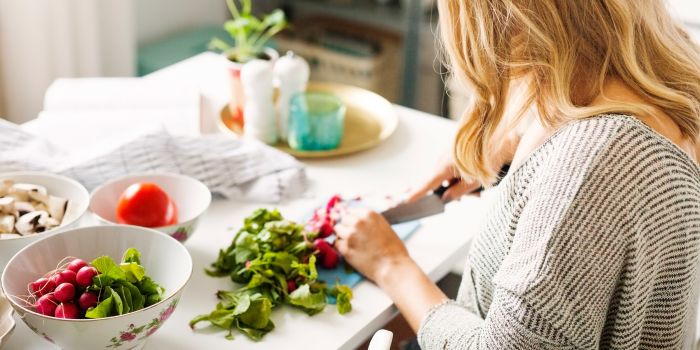 woman cutting vegetables