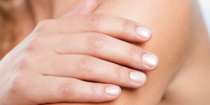woman checking mole