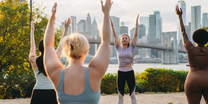 Group doing yoga outside