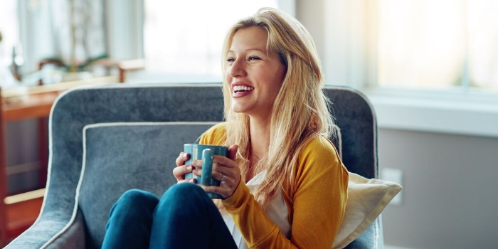person enjoying a warm drink indoors