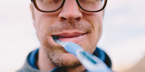 Man brushing teeth