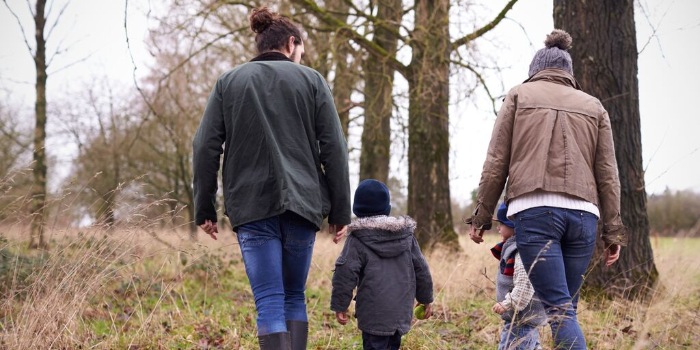 Family walking in the woods