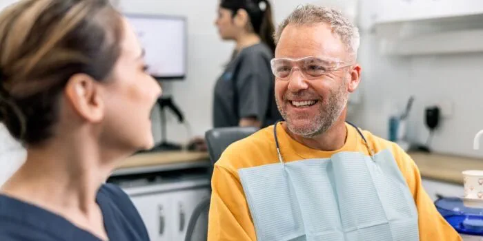 two dentist colleagues smiling at work