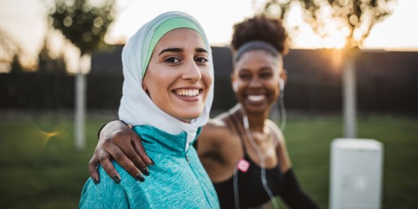 two friends jogging in the park