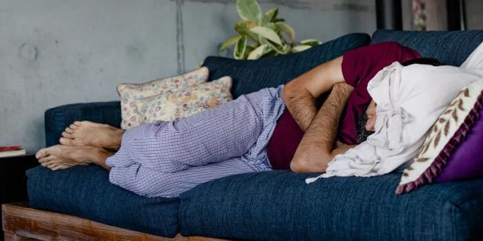 man sleeping on the sofa